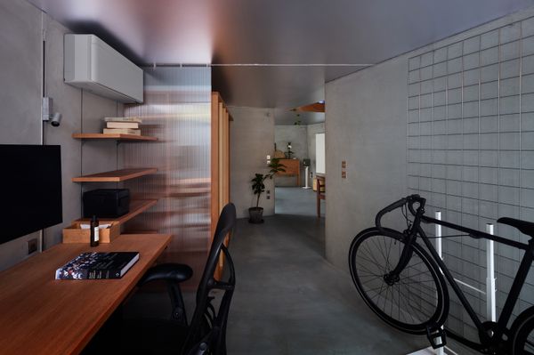 A Ceiling Cutout Above the Dining Area in This Kyoto Home Doubles as a Desk