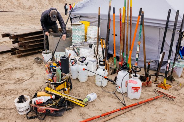 Contestants spread out their quivers of building tools including shovels, buckets, spray bottles, and plywood forms.