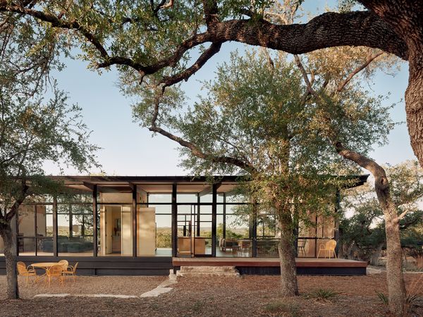 Constructed primarily of dark steel and glass, the simple, rectangular form blends seamlessly with its surroundings.
