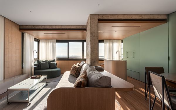 The architects preserved the functions of the porch, as a place to lounge and grill, but removed the walls and doors to integrate them into the home. "The balconies were barely used and felt separate from the rest of the home,